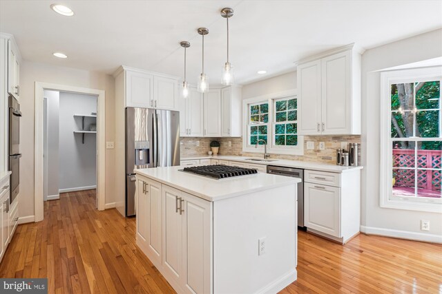 19802 Shady Brook Way, Gaithersburg, MD 20879 - kitchen featuring stainless steel appliances, white cabinetry, decorative backsplash, light wood-style floors, and recessed lighting
