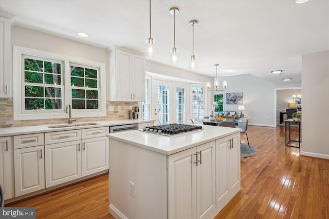 19802 Shady Brook Way, Gaithersburg, MD 20879 - kitchen with stainless steel appliances, a chandelier, tasteful backsplash, light wood finished floors, and recessed lighting