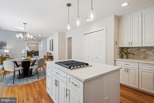 19802 Shady Brook Way, Gaithersburg, MD 20879 - kitchen featuring stainless steel gas stovetop, a chandelier, light wood-style flooring, backsplash, and recessed lighting