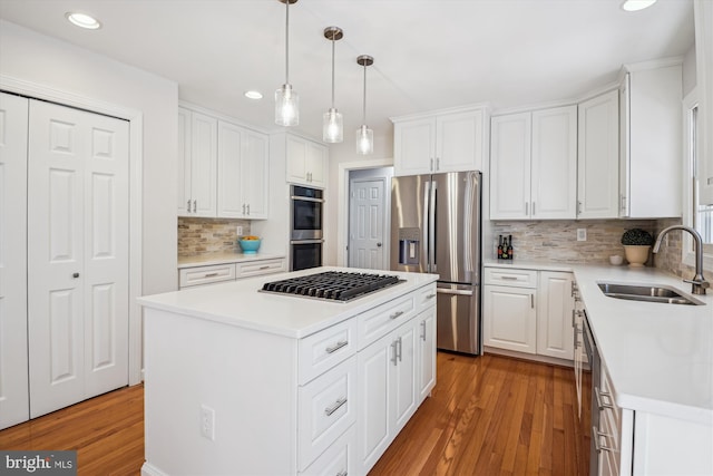 19802 Shady Brook Way, Gaithersburg, MD 20879 - kitchen featuring stainless steel appliances, recessed lighting, white cabinetry, light wood finished floors, and tasteful backsplash