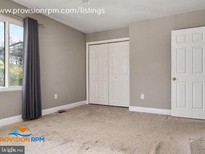 1324 Hazel Nut Ct, Annapolis, MD 21409 - unfurnished bedroom featuring carpet flooring, baseboards, and a closet