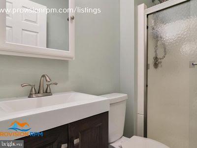 1324 Hazel Nut Ct, Annapolis, MD 21409 - full bath with toilet, a stall shower, and vanity