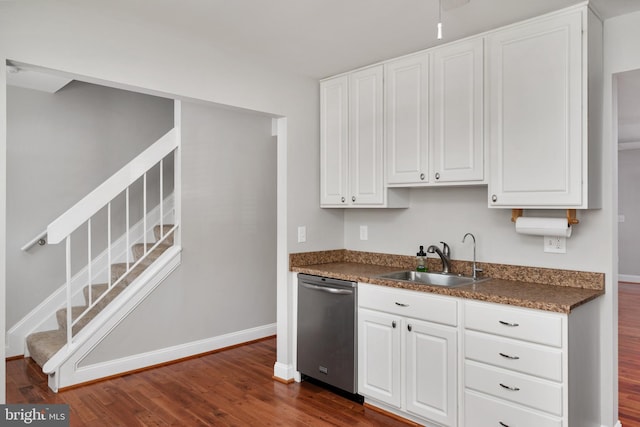 1324 Hazel Nut Ct, Annapolis, MD 21409 - kitchen featuring dishwasher, a sink, dark wood-style flooring, dark countertops, and white cabinets
