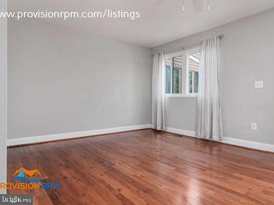 1324 Hazel Nut Ct, Annapolis, MD 21409 - empty room with wood finished floors and baseboards
