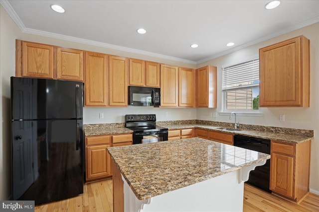 126 Backstretch Way, Prince Frederick, MD 20678 - kitchen with black appliances, a sink, light wood finished floors, ornamental molding, and a center island