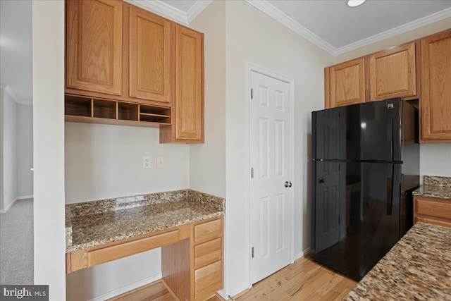 126 Backstretch Way, Prince Frederick, MD 20678 - kitchen featuring freestanding refrigerator, ornamental molding, stone countertops, and light wood-style flooring
