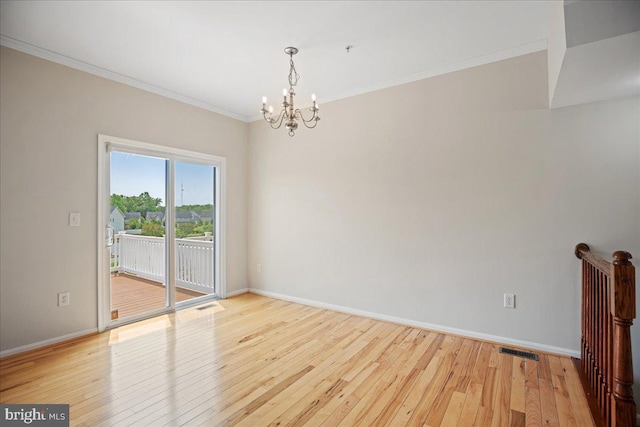 126 Backstretch Way, Prince Frederick, MD 20678 - spare room with a chandelier, light wood finished floors, baseboards, and crown molding