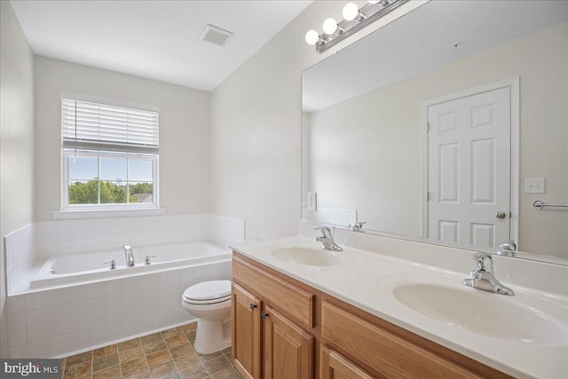 126 Backstretch Way, Prince Frederick, MD 20678 - full bath featuring toilet, a bath, double vanity, and stone finish flooring