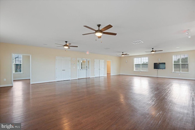 126 Backstretch Way, Prince Frederick, MD 20678 - unfurnished living room featuring a ceiling fan, wood finished floors, and baseboards