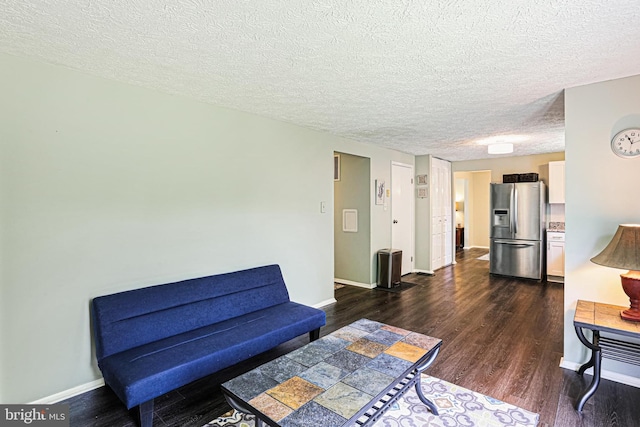 6786 Singletree Ct, Frederick, MD 21703 - living area featuring dark wood-style flooring, baseboards, and a textured ceiling