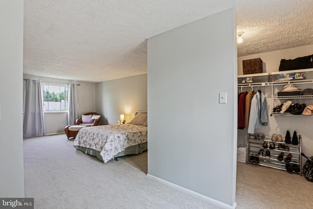 6786 Singletree Ct, Frederick, MD 21703 - bedroom featuring a textured ceiling, carpet, a closet, a spacious closet, and baseboards