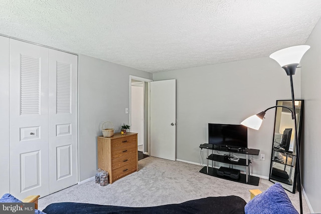 6786 Singletree Ct, Frederick, MD 21703 - bedroom with a closet, a textured ceiling, carpet, and baseboards