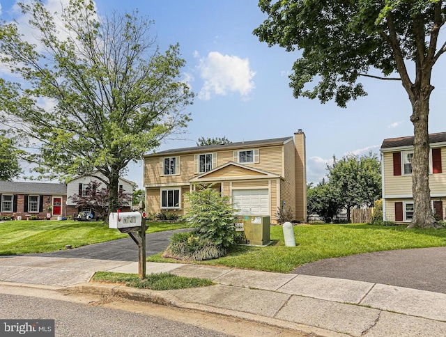 6786 Singletree Ct, Frederick, MD 21703 - view of front facade with driveway, a chimney, a garage, and a front lawn