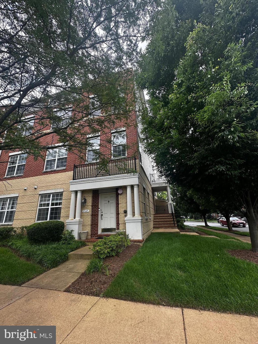 43643 Mcdowell Sq, Leesburg, VA 20176 - view of front of house featuring brick siding and a balcony