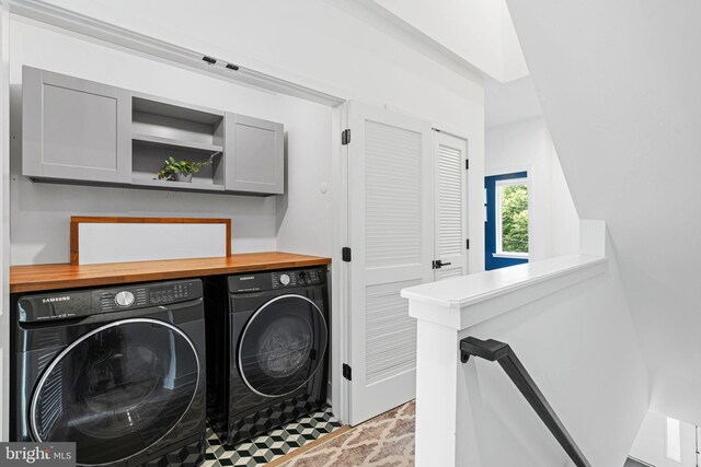 2206 E Fletcher St, Philadelphia, PA 19125 - laundry area featuring washer and dryer and cabinet space