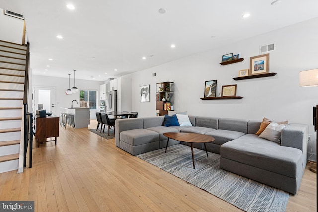 2206 E Fletcher St, Philadelphia, PA 19125 - living area with stairs, light wood-style floors, and recessed lighting