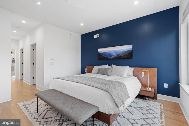 2206 E Fletcher St, Philadelphia, PA 19125 - bedroom with recessed lighting, an accent wall, light wood-style floors, and baseboards