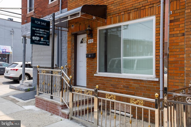 802 W Ritner St, Philadelphia, PA 19148 - view of exterior entry featuring brick siding