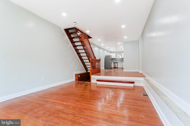 802 W Ritner St, Philadelphia, PA 19148 - unfurnished living room featuring stairs, light wood-style flooring, and recessed lighting