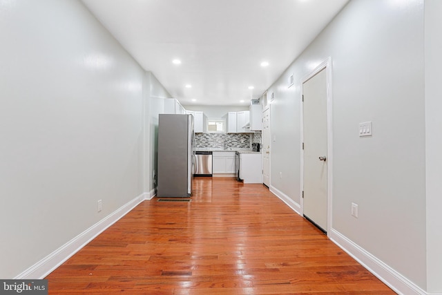 802 W Ritner St, Philadelphia, PA 19148 - unfurnished living room with light wood finished floors and recessed lighting