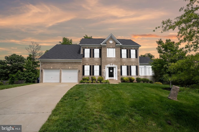 12916 Steam Mill Farm Dr, Brandywine, MD 20613 - view of front of house with a garage, concrete driveway, a front lawn, and brick siding