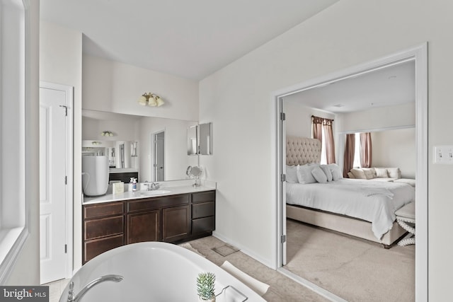 12916 Steam Mill Farm Dr, Brandywine, MD 20613 - bathroom with ensuite bathroom, a soaking tub, vanity, and baseboards