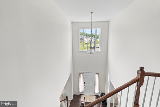 12916 Steam Mill Farm Dr, Brandywine, MD 20613 - foyer featuring dark wood-style flooring, a high ceiling, a chandelier, and baseboards