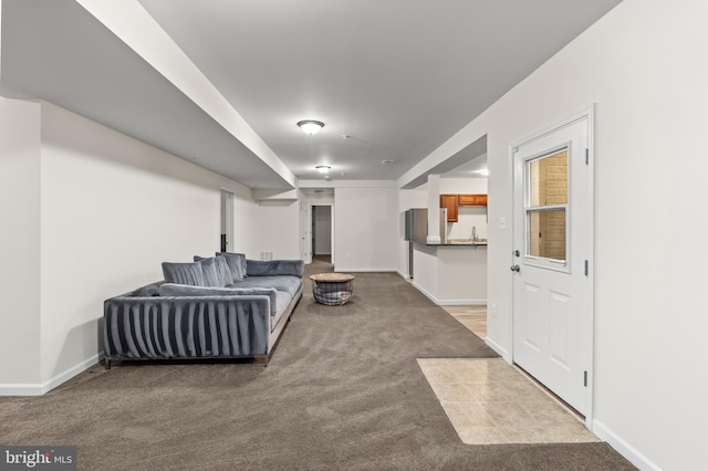 12916 Steam Mill Farm Dr, Brandywine, MD 20613 - carpeted living room featuring baseboards and a sink