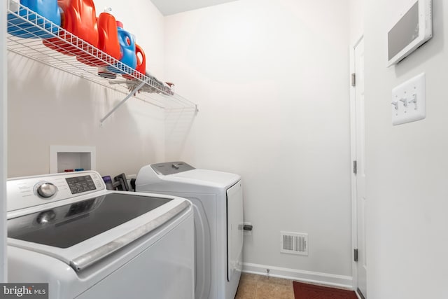 12916 Steam Mill Farm Dr, Brandywine, MD 20613 - washroom featuring separate washer and dryer, baseboards, and tile patterned floors