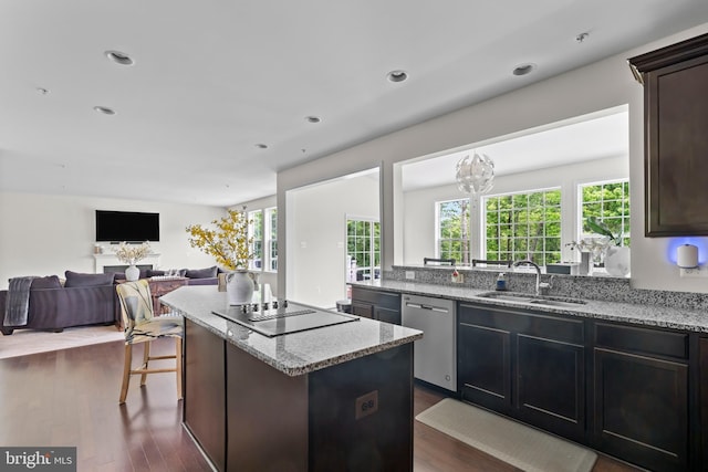 12916 Steam Mill Farm Dr, Brandywine, MD 20613 - kitchen featuring dishwasher, a sink, black electric cooktop, a kitchen island, and light stone counters