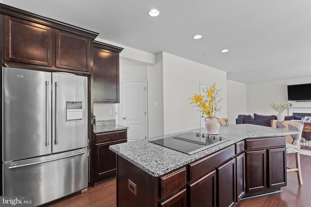 12916 Steam Mill Farm Dr, Brandywine, MD 20613 - kitchen with high end refrigerator, black electric stovetop, dark wood finished floors, a kitchen island, and open floor plan