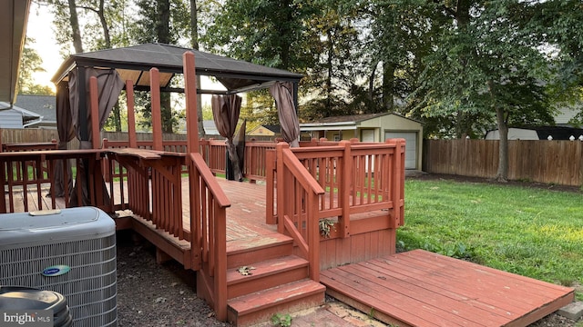 7209 Halifax Pl, Springfield, VA 22150 - deck with a fenced backyard, a gazebo, an outdoor structure, and a detached garage