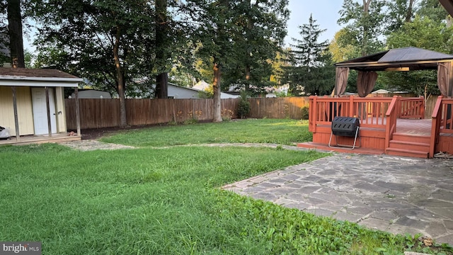 7209 Halifax Pl, Springfield, VA 22150 - fenced backyard with a gazebo, a storage shed, and a wooden deck