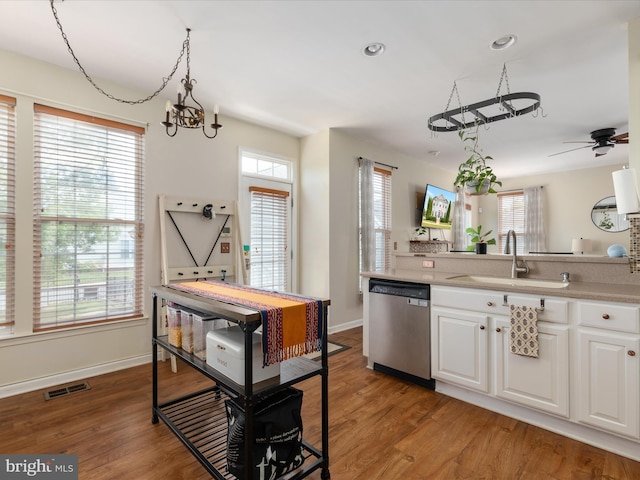 6040 Gayleburg Pl, Gainesville, VA 20155 - kitchen with stainless steel dishwasher, a sink, white cabinets, baseboards, and recessed lighting