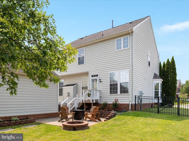 6040 Gayleburg Pl, Gainesville, VA 20155 - back of property featuring a fire pit and a patio
