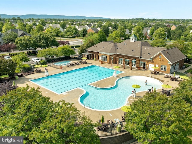 6040 Gayleburg Pl, Gainesville, VA 20155 - community pool featuring a jacuzzi, a patio, and a residential view