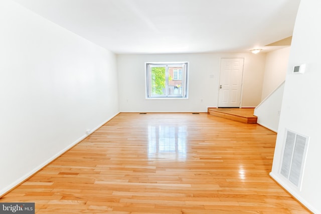 10256 Quiet Pond Ter, Burke, VA 22015 - unfurnished room featuring wood finished floors, baseboards, and stairway