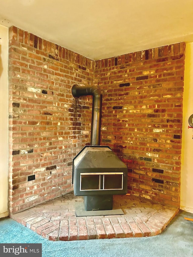 1033 Genine Dr, Glen Burnie, MD 21060 - detailed view of carpet flooring and a wood stove