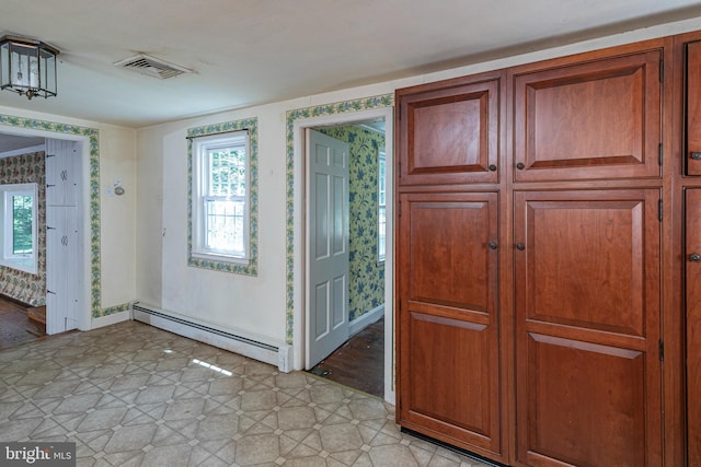 100 Carson Rd, Princeton, NJ 08540 - entryway featuring a baseboard heating unit, plenty of natural light, light tile patterned floors, and baseboards