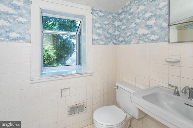 100 Carson Rd, Princeton, NJ 08540 - bathroom with wallpapered walls, tile walls, toilet, a wainscoted wall, and a sink