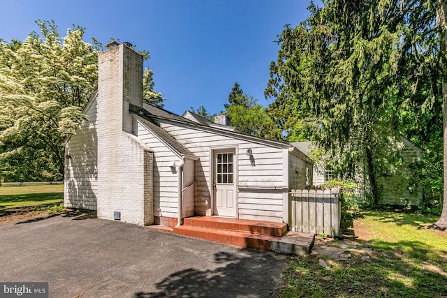 100 Carson Rd, Princeton, NJ 08540 - view of front of property with a chimney and a patio