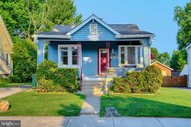 5919 Sefton Ave, Baltimore, MD 21214 - bungalow-style home featuring covered porch and roof with shingles