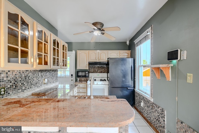 5919 Sefton Ave, Baltimore, MD 21214 - kitchen with black appliances, range hood, tasteful backsplash, a ceiling fan, and glass insert cabinets