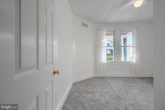 5919 Sefton Ave, Baltimore, MD 21214 - carpeted empty room featuring baseboards, ceiling fan, and a textured ceiling
