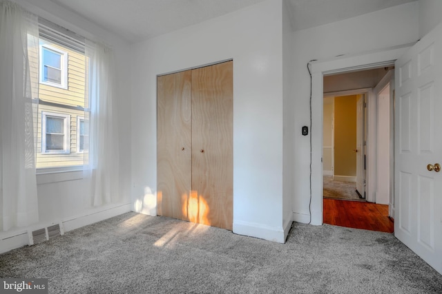 5919 Sefton Ave, Baltimore, MD 21214 - unfurnished bedroom with carpet flooring, a closet, and baseboards