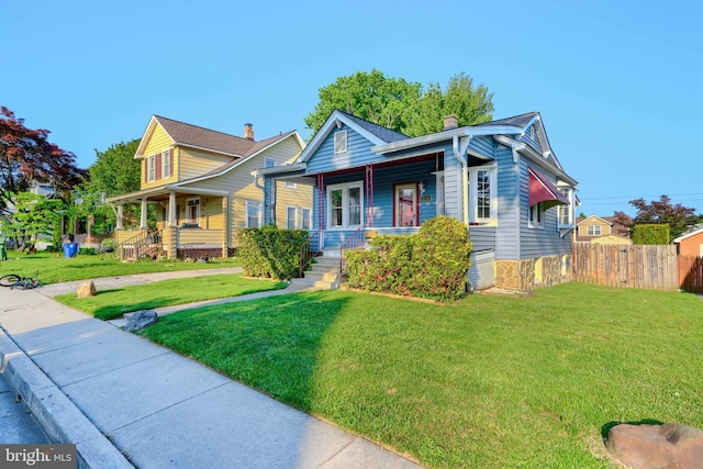 5919 Sefton Ave, Baltimore, MD 21214 - view of front of house featuring covered porch and a chimney
