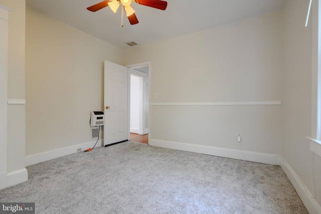 5919 Sefton Ave, Baltimore, MD 21214 - carpeted spare room featuring a ceiling fan, baseboards, and heating unit