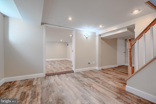 5919 Sefton Ave, Baltimore, MD 21214 - finished basement featuring wood finished floors, baseboards, stairway, and recessed lighting