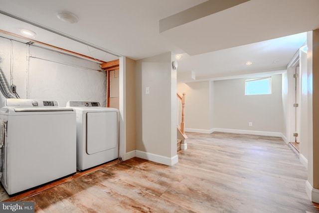 5919 Sefton Ave, Baltimore, MD 21214 - laundry room with washer and dryer, light wood-type flooring, baseboards, and recessed lighting