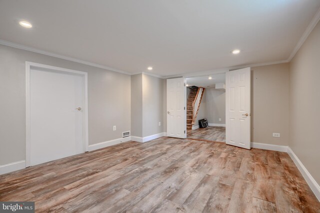 5919 Sefton Ave, Baltimore, MD 21214 - finished basement with stairway, ornamental molding, light wood-type flooring, recessed lighting, and baseboards